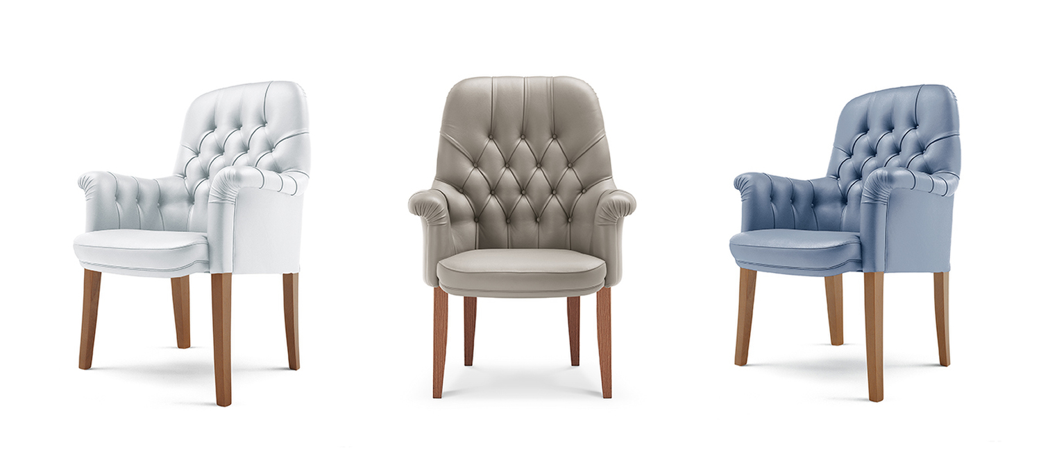 Oxford | Poltrona Visitor Poltrona Oxford Visitor Poltrona Frau con struttura in faggio stagionato, rivestimento in Pelle Frau® con lavorazione capitonné artigianale e base a quattro gambe in nocino d’America tinto Noce medio, design italiano di lusso